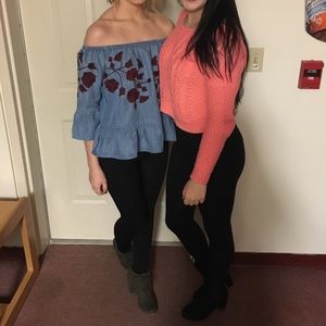 Denim off the shoulder shirt on the left